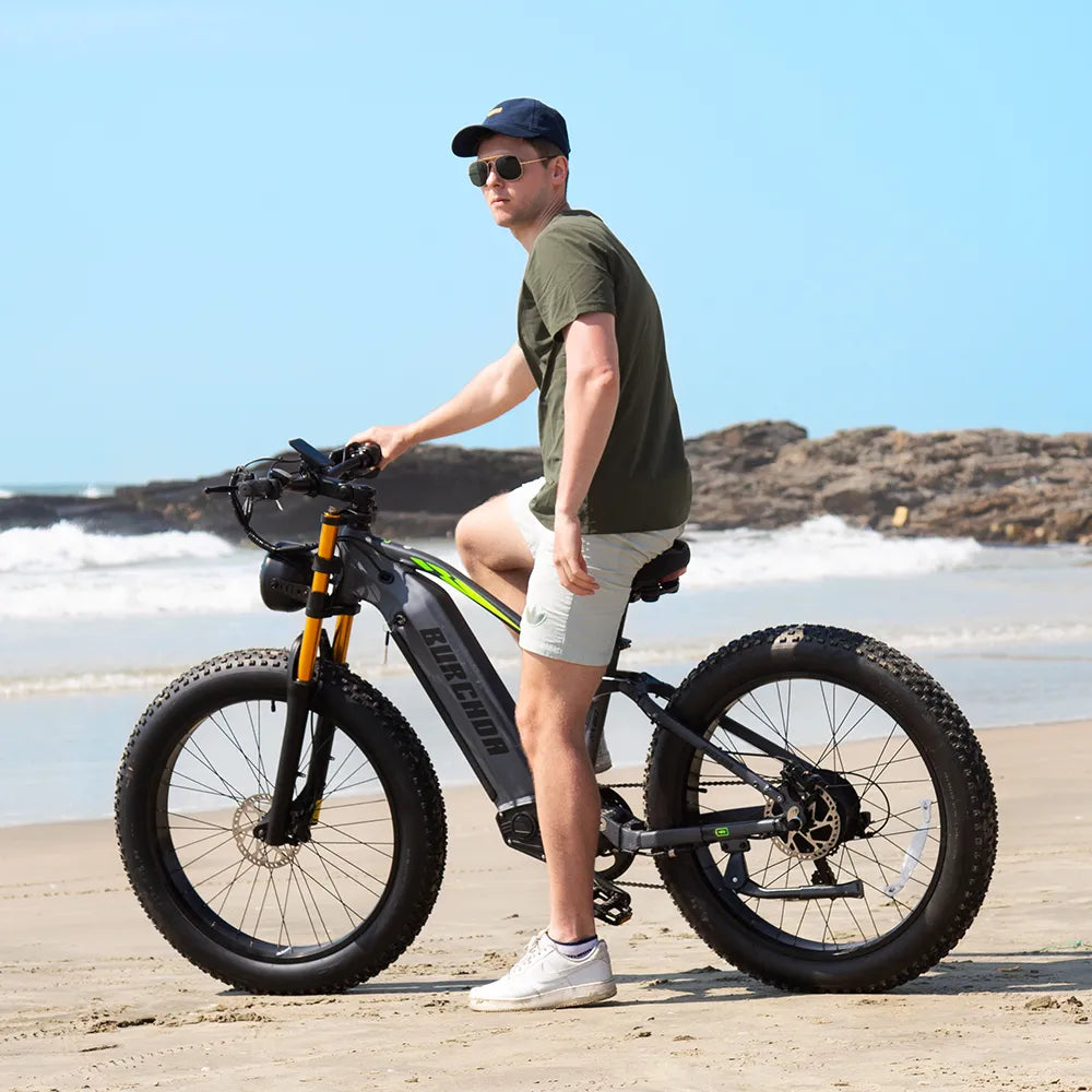 A man riding a Burchda RX80 by the seaside