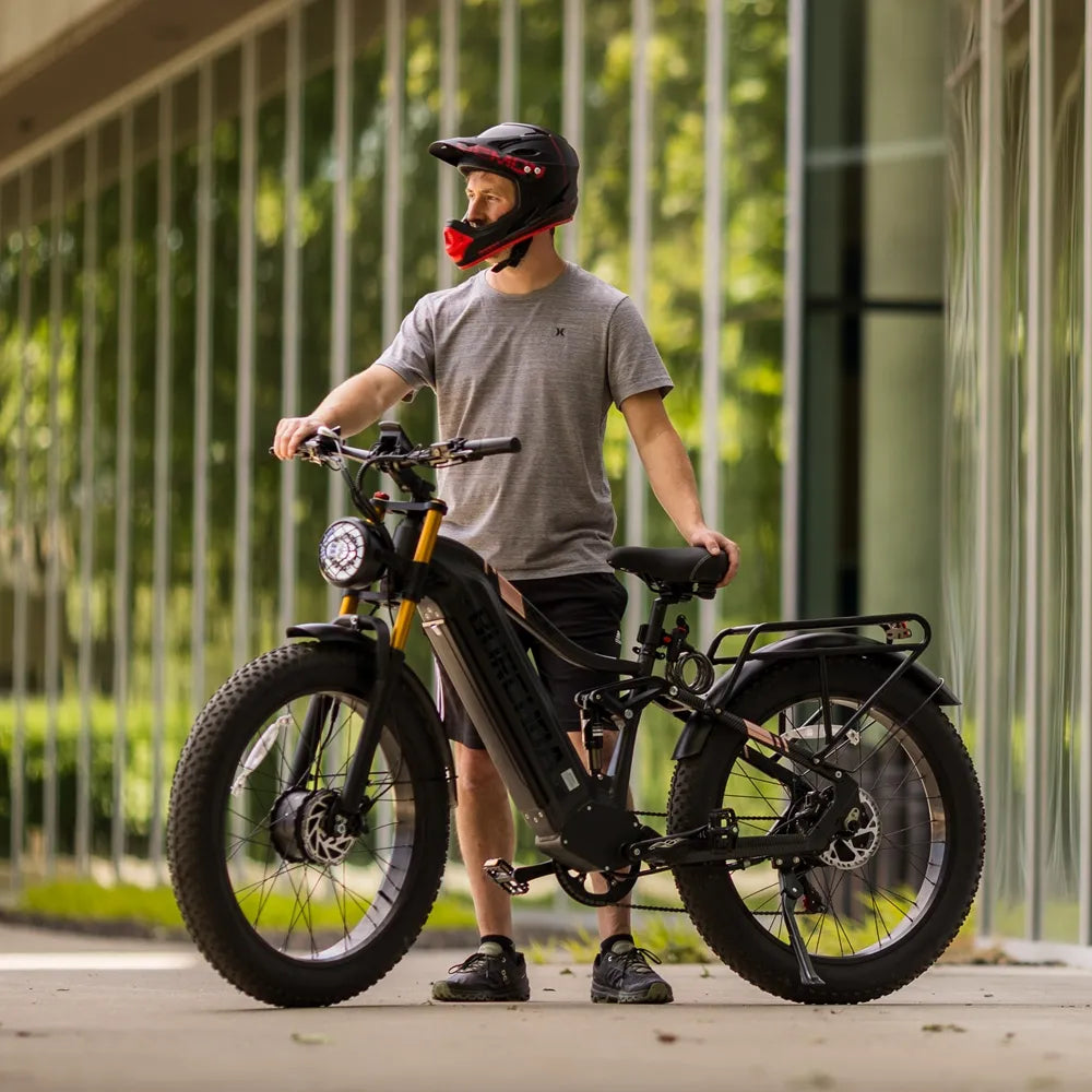A man is riding an HC26 AWD fat-tire e-bike through the city